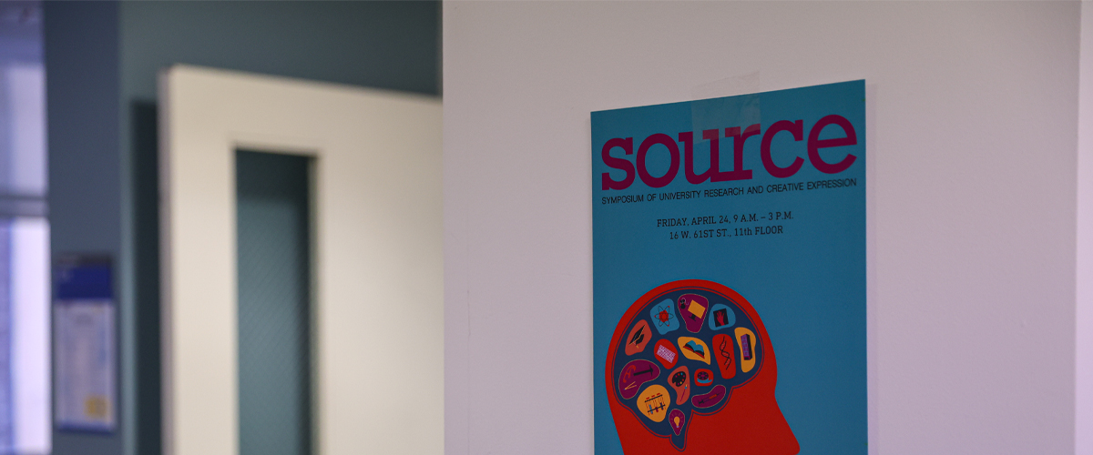 SOURCE poster on a wall