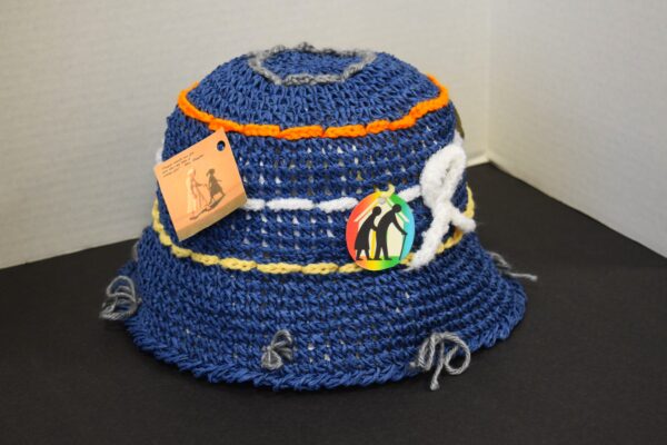 handmade woven/crocheted hat, yarn, fabric, paper tags