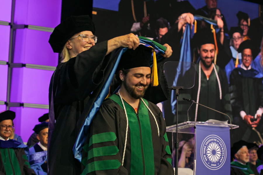 Student being hooded