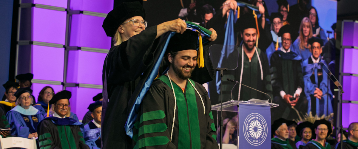 Student being hooded