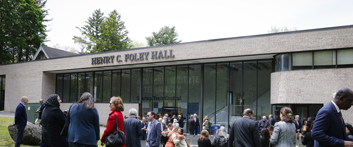 People mingling in front of building