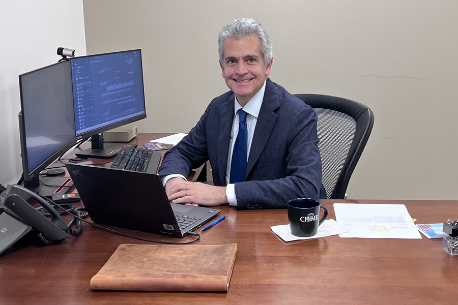 Gonzalo Romero Lauro sitting at a desk