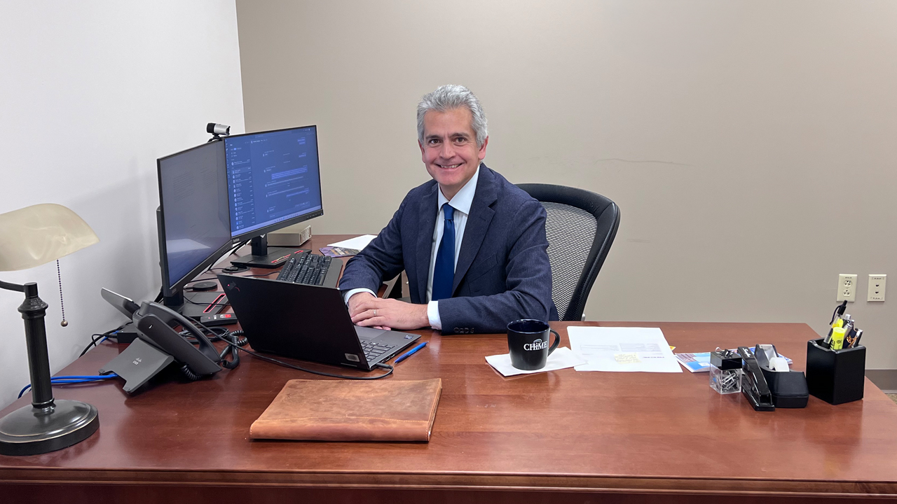 Gonzalo Romero Lauro sitting at a desk