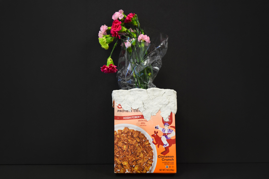 Cereal box with flowers coming out of the top