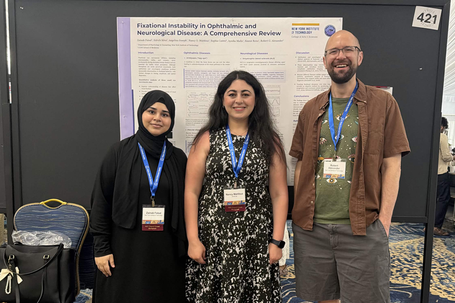 Students and their professor standing in front of a poster.
