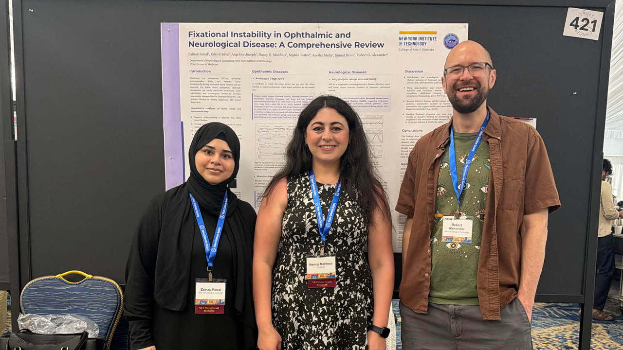 Students and their professor standing in front of a poster.