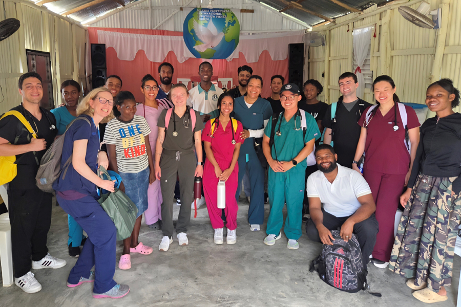 Group of students, faculty, and local people