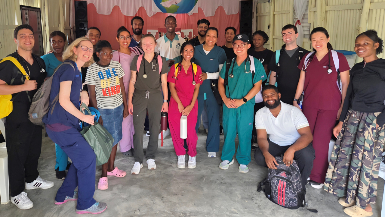 Group of students, faculty, and local people