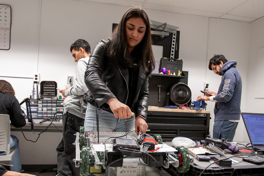 A student is working on robotics.