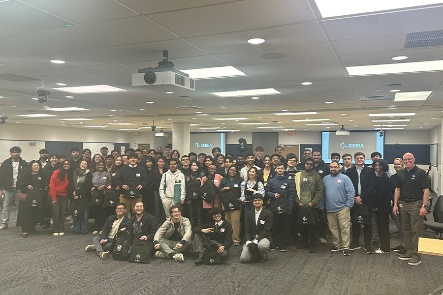 A large group photo of students, faculty, and staff