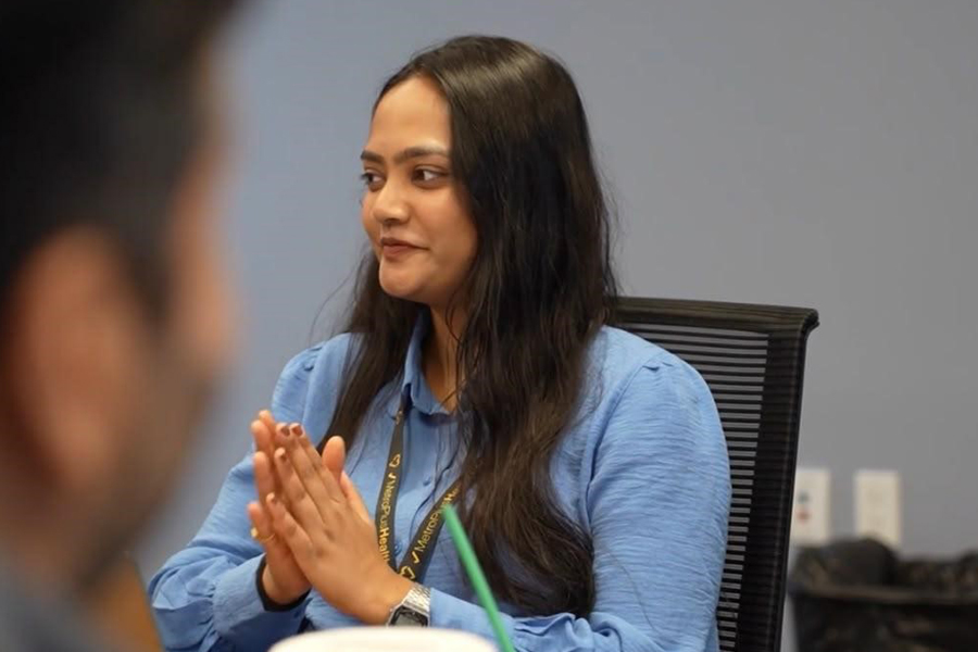 Mansi Santosh Tikam sitting at a table