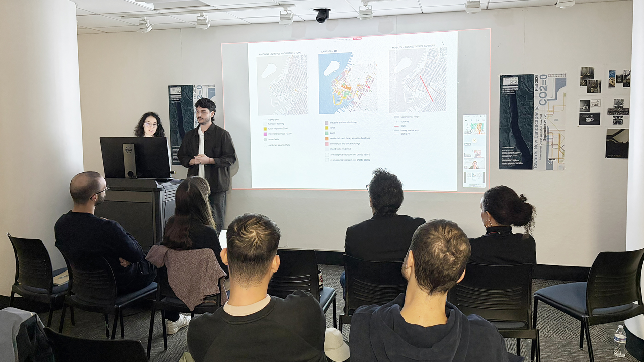 Students standing at a podium presenting research on a large screen