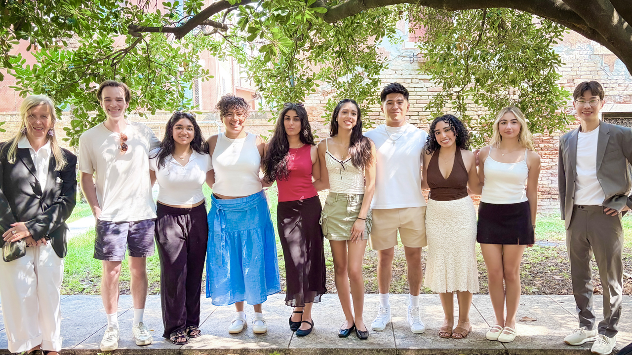 Group of students standing under a tree