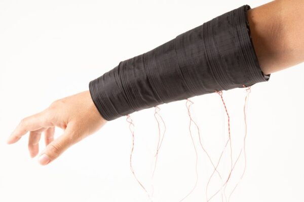A black pneumatic affective sleeve with wires coming out of it.