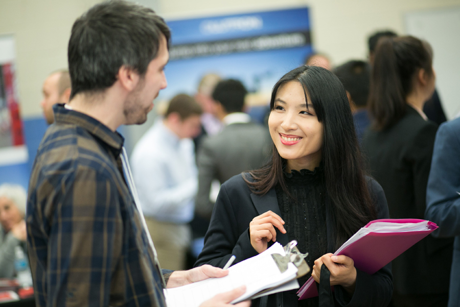 Two people at a job fair.