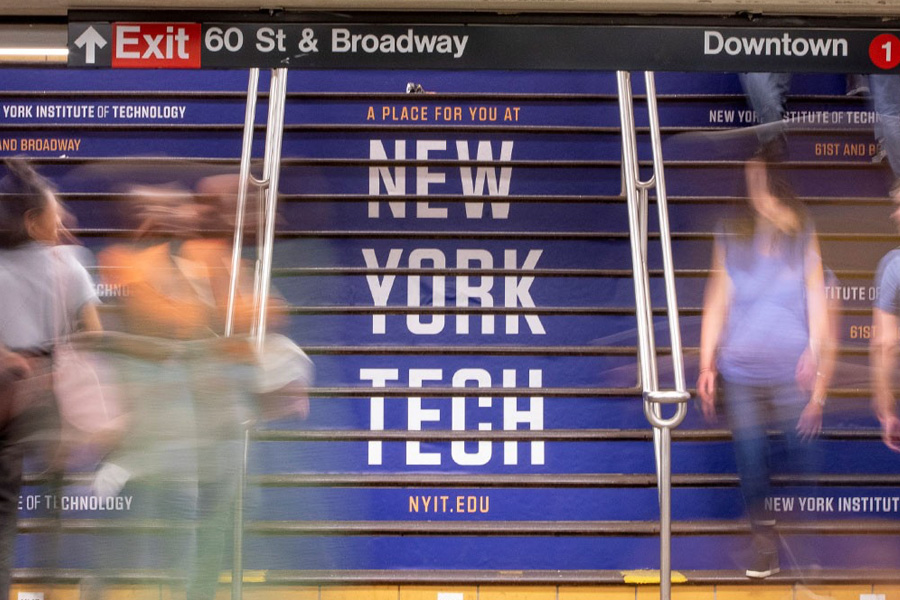 New York Tech ad written on the stairs in a New York City subway station